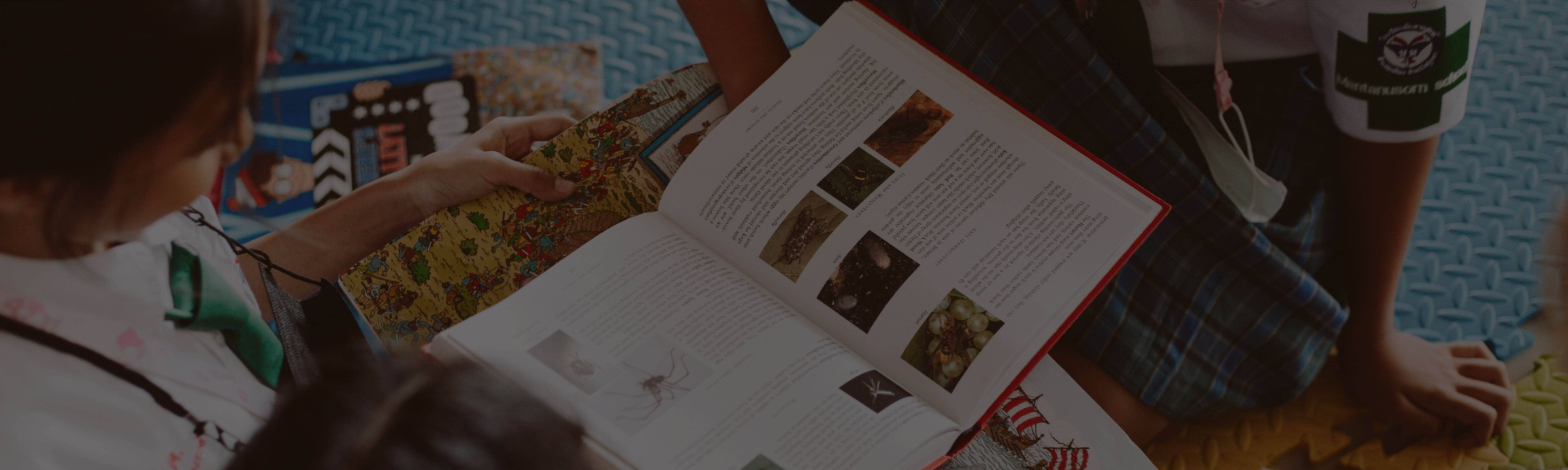 Children are reading a book